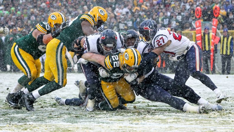 Green Bay's Aaron Ripkowski, in the No. 22 jersey, scores a touchdown in the fourth quarter against Houston in Green Bay, Wisconsin, on Sunday, December 4. Green Bay won 21-13.
