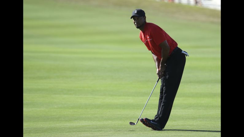 Tiger Woods watches his shot from the 14th fairway during the final round of the Hero World Challenge in Nassau, Bahamas, on Sunday, December 4. Woods finished 15th out of 17.