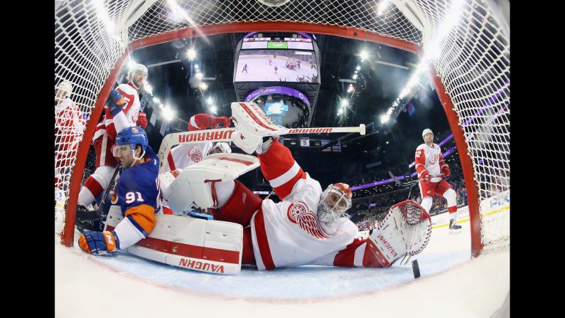 Detroit's Petr Mrazek watches as a shot by New York's Josh Bailey goes into the goal during an NHL hockey game in Brooklyn, New York, on Sunday, December 4. Detroit won 4-3 in overtime.