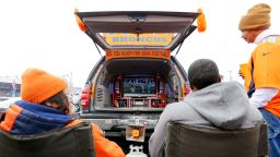 DENVER, CO - JANUARY 11: Denver Broncos fans watch football on a TV in the back of their car as they have a tail gate party outside of the venue before a 2015 AFC Divisional Playoff game between the Denver Broncos and the Indianapolis Colts at Sports Authority Field at Mile High on January 11, 2015 in Denver, Colorado.  (Photo by Justin Edmonds/Getty Images)