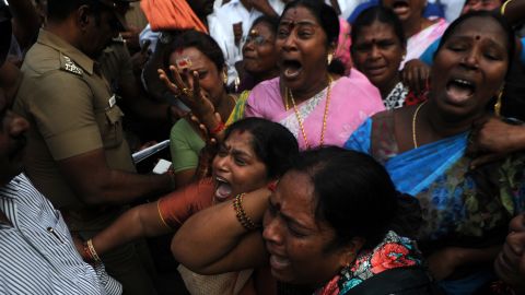 Indian supporters of the Chief Minister of Tamil Nadu Jayalalithaa Jayaram react outside the hospital where she was being treated in Chennai on December 5, 2016. 