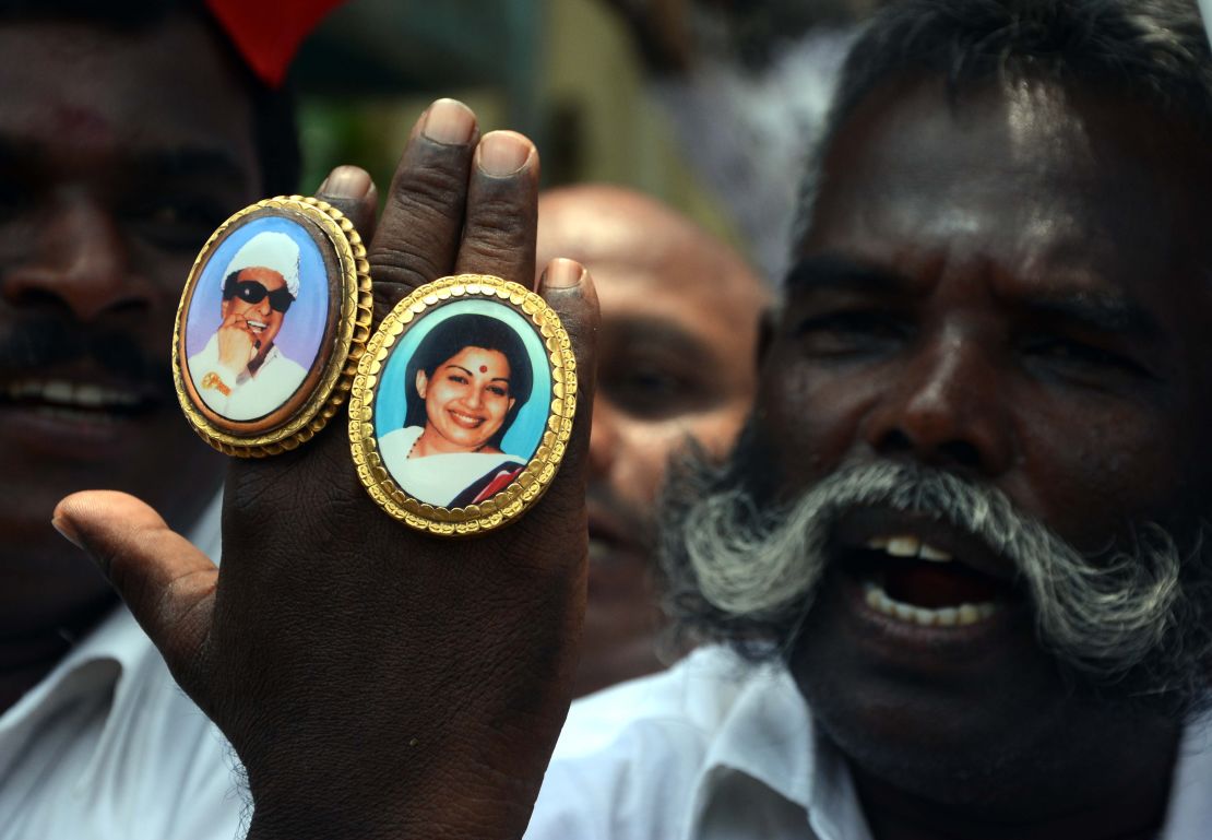 Jayalalithaa (R) and M. G. Ramachandran (L) pictured on the hand of a party supporter.