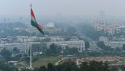 In this photograph taken on February 24, 2015, shows the Indian tri-colour as it flies over Connaught Place in New Delhi, ahead of World Environment Day which falls on June 5.   The Indian government is under intense pressure to act after the World Health Organization last year declared New Delhi the world's most polluted capital.  At least 3,000 people die prematurely every year in the city because of air pollution, according to a joint study by Boston-based Health Effects Institute and Delhi's Energy Resources Institute.  AFP PHOTO / CHANDAN KHANNA        (Photo credit should read Chandan Khanna/AFP/Getty Images)