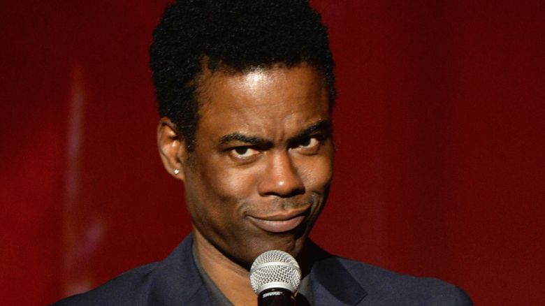 Comedian Chris Rock speaks onstage during An Evening of Music, Art, Mischief and Performance to benefit Raising Malawi presented by Madonna at Faena Forum on December 2, 2016 in Miami Beach, Florida.  (Photo by Kevin Mazur/Getty Images for Bulgari)