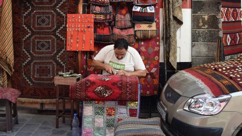 Ali Othman, a weaver photographed by Humans of Damascus, reconstructs carpets in the city.