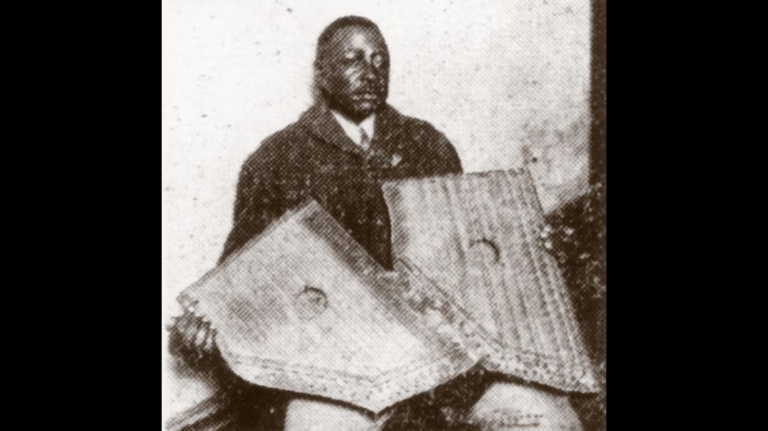 Phillips holding two fretless zithers, which he apparently played on his records.