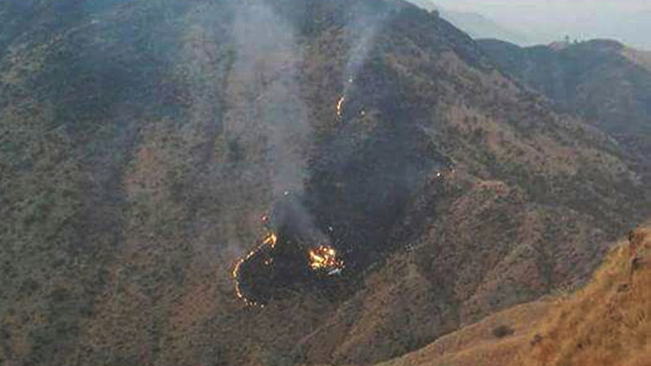 Flames rise from the wreckage of the Pakistan International Airlines flight that crashed Wednesday.