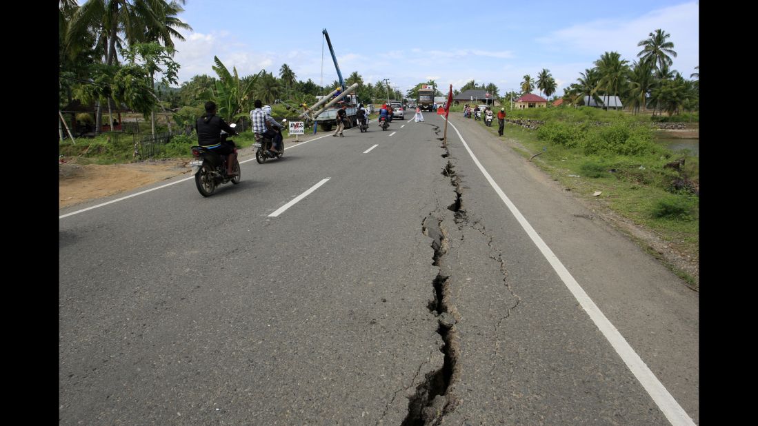 A crack caused by the earthquake is seen along a road in Sigli, Aceh province.