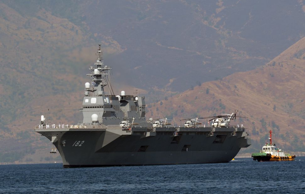 Japanese helicopter carrier Ise, one of Japan's biggest warships, is towed as it prepares to dock at the former US naval base at Subic Bay, Philippines, on April 26, 2016. 