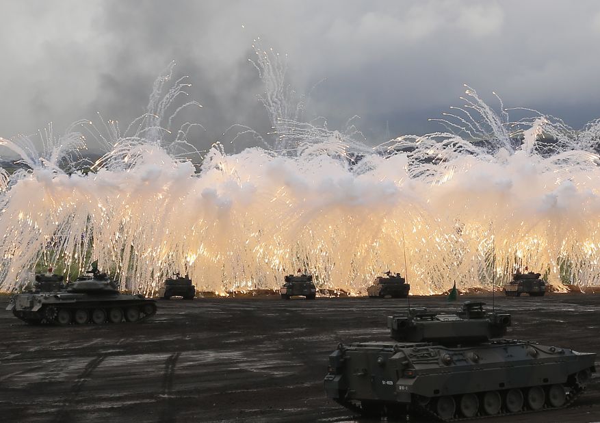 Japan Self-Defense Force tanks and other armored vehicles take part in an exercise at the military's East Fuji Maneuver Area on August 25, 2016, in Gotemba, Japan. Japan has one tank division and three armored infantry divisions.