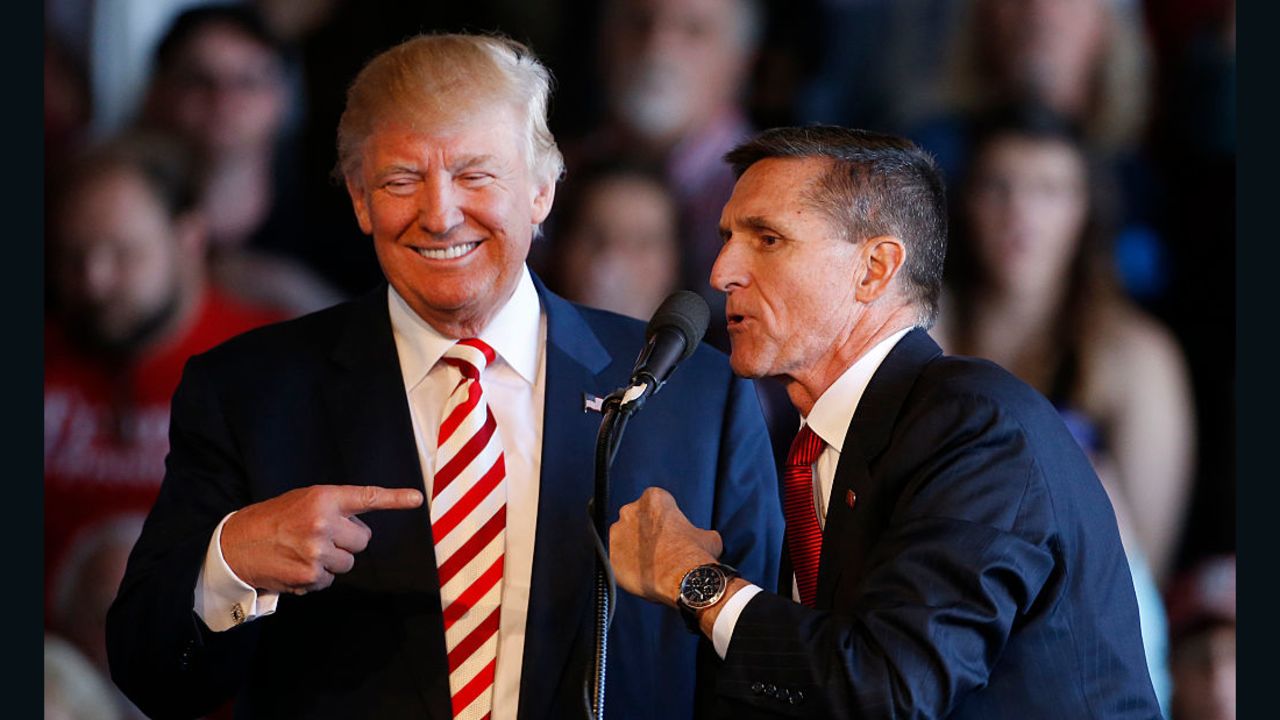 GRAND JUNCTION, CO - OCTOBER 18: Republican presidential candidate Donald Trump (L) jokes with retired Gen. Michael Flynn as they speak at a rally at Grand Junction Regional Airport on October 18, 2016 in Grand Junction Colorado. Trump is on his way to Las Vegas for the third and final presidential debate against Democratic rival Hillary Clinton. (Photo by George Frey/Getty Images)