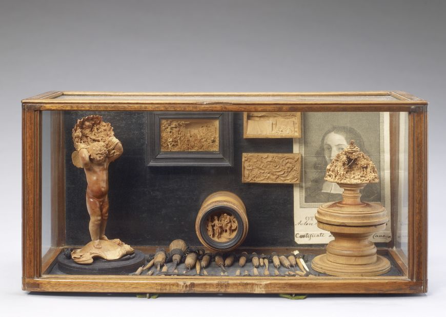The boxwood miniatures were coveted collectables soon after their production ceased. This case of objects from Baroque sculptor Jannella Ottaviano shows his own collection of boxwood, which dates back to the 17th century.