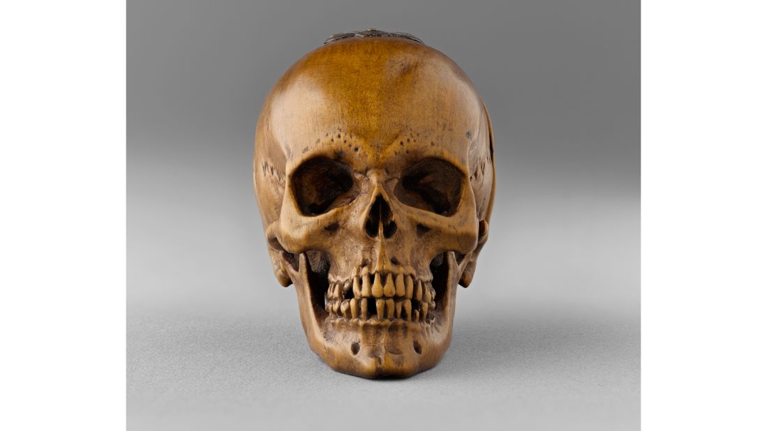 This prayer bead was carved into the shape of a skull. 