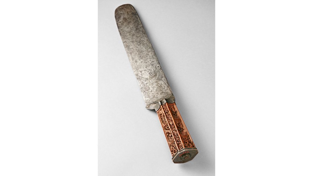 This Flemish knife, on loan from the Louvre in Paris, has Biblical scenes carved into its hilt. 