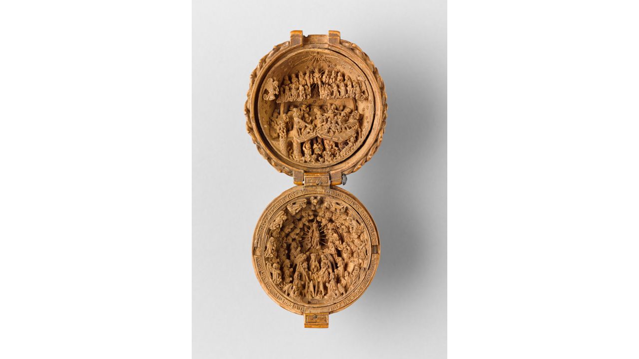 This prayer bead is attributed to the workshop of Adam Dirksz. However, experts remain unsure as to who actually created the boxwood miniatures. They're singular style seems to suggest one maker. 