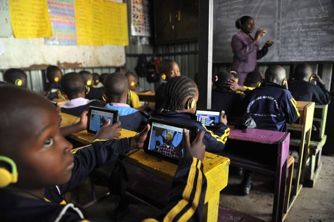 Education is a big priority for Kenyans, with over 80% believing it will be better for the next generation.<br /><br />Pictured here, pupils use the Kio tablet during a class sesssion in Kawangware, Nairobi in October 2015. 