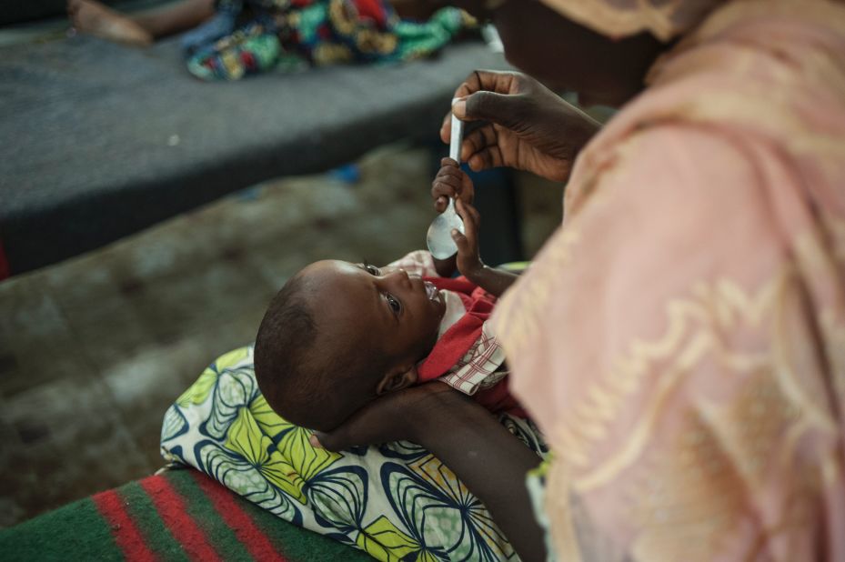 This optimism extends to health care too, as nearly 90% of Nigerians believe health care will be better for the next generation.<br /><br />Pictured here, a woman feeds her young baby suffering from severe malnutrition in the Gwangwe district of Maiduguri, the capital of Borno State, northeastern Nigeria, in September 2016. 