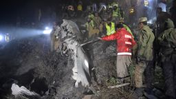 Pakistani soldiers and volunteers search for victims from the wreckage of the crashed PIA passenger plane Flight PK661 at the site in the village of Saddha Batolni in the Abbottabad district of Khyber Pakhtunkhwa province on December 7, 2016.
A Pakistani plane carrying 48 people crashed on December 7, in the country's mountainous north and burst into flames killing everyone on board, authorities said, in one of the deadliest aviation accidents in the country's history. Pakistan International Airlines Flight PK661 came down while travelling from the city of Chitral to Islamabad, the civil aviation authority said. / AFP / AAMIR QURESHI        (Photo credit should read AAMIR QURESHI/AFP/Getty Images)