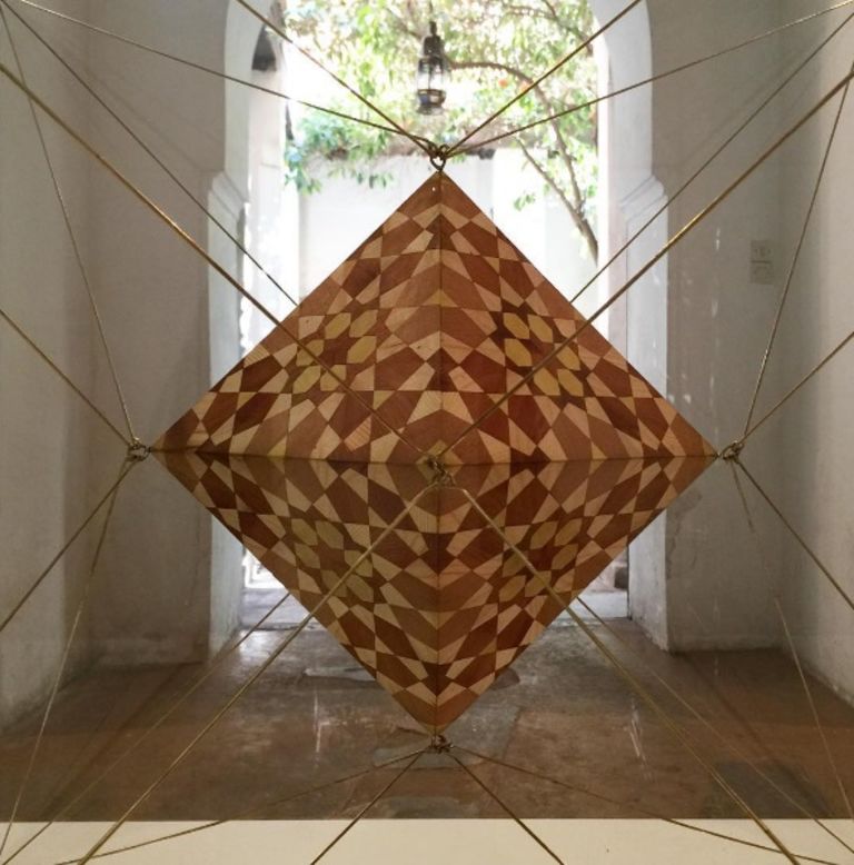 Beyond paintings, the artist aims to explore new forms of geometric art. This complex installation at the Marrakesh Biennale features a dodecahedron within a glass Icosahedron. 