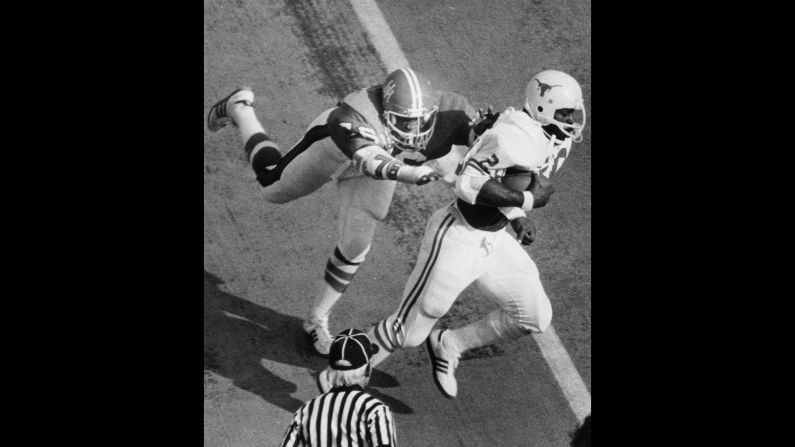 Earl Campbell of the University of Texas runs with the football during a 1977 game against the University of Houston.