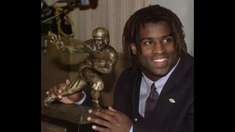 Texas tailback Ricky Williams poses with the Heisman Trophy at the Downtown Athletic Club in New York on December 12, 1998.