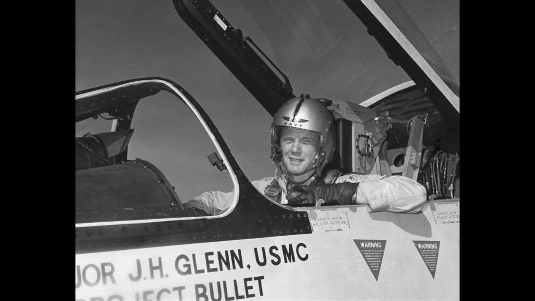 During World War II, Glenn enlisted in the Naval Aviation Cadet Program in 1942 and became a pilot for the US Marines a year later. Glenn, pictured here in the cockpit of an F-8 fighter, completed nearly 150 combat missions in World War II and the Korean War.