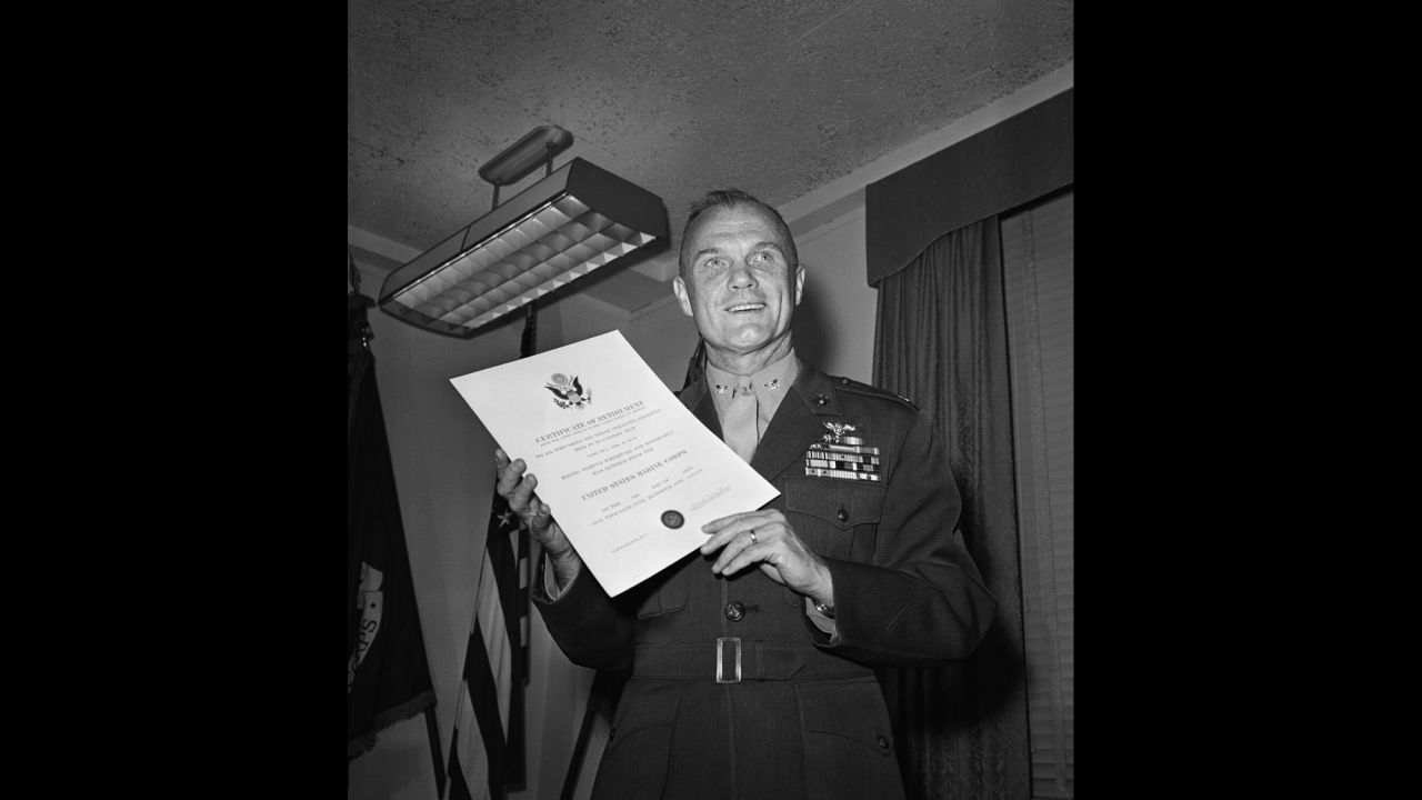 Glenn holds his discharge papers after he retired from the Marine Corps and resigned from NASA's astronaut program. Now a national figure, he went on to become an executive for the Royal Crown Cola Co. He would soon explore a career in politics.