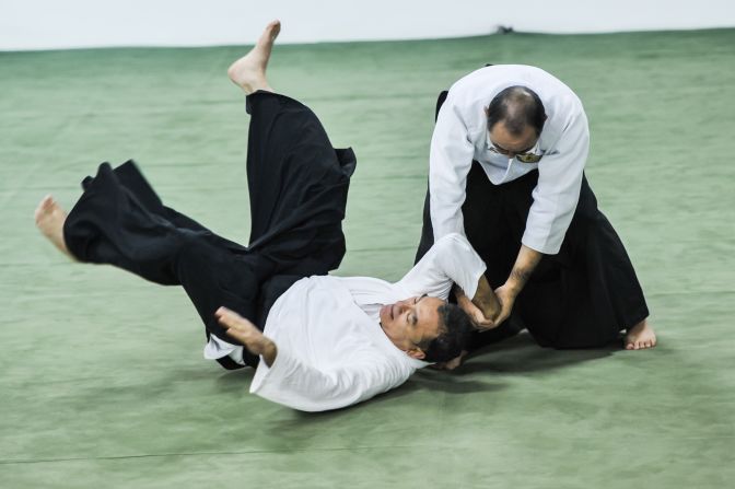 Today, aikido is practiced in dojos all over the world. There are no punches or kicks. It's a form of self-defence that, through locks, holds and throws, uses an opponent's own energy against them.  
