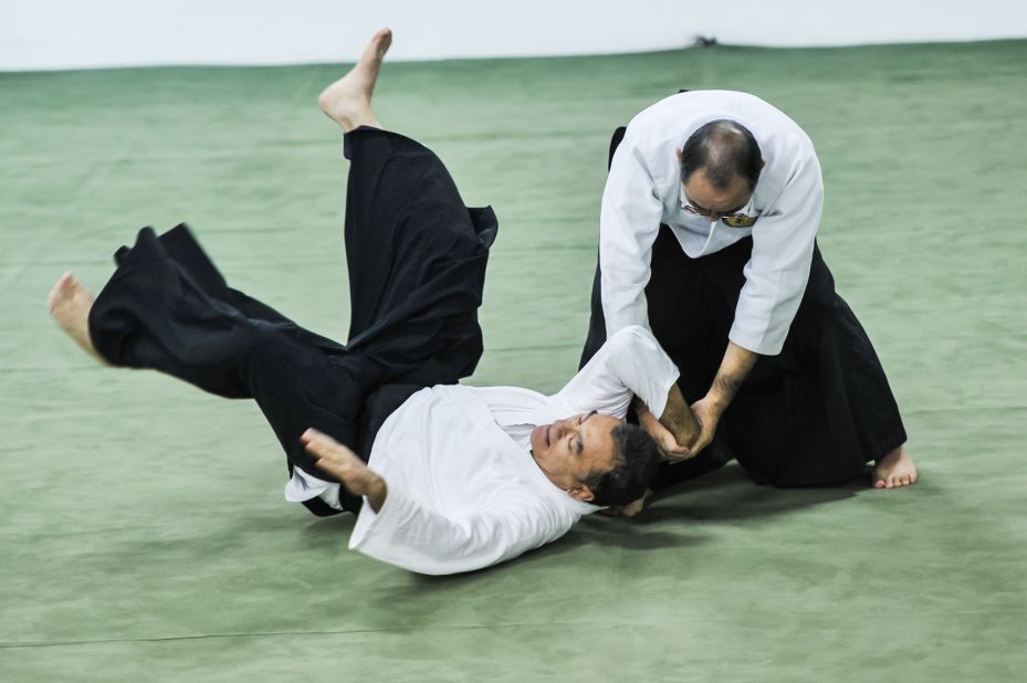 Today, aikido is practiced in dojos all over the world. There are no punches or kicks. It's a form of self-defence that, through locks, holds and throws, uses an opponent's own energy against them.  