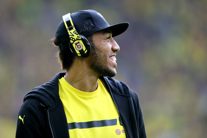 The Gabon international is also known for fashion statements off the pitch, often using a pair of Borussia Dortmund's own brightly colored headphones.