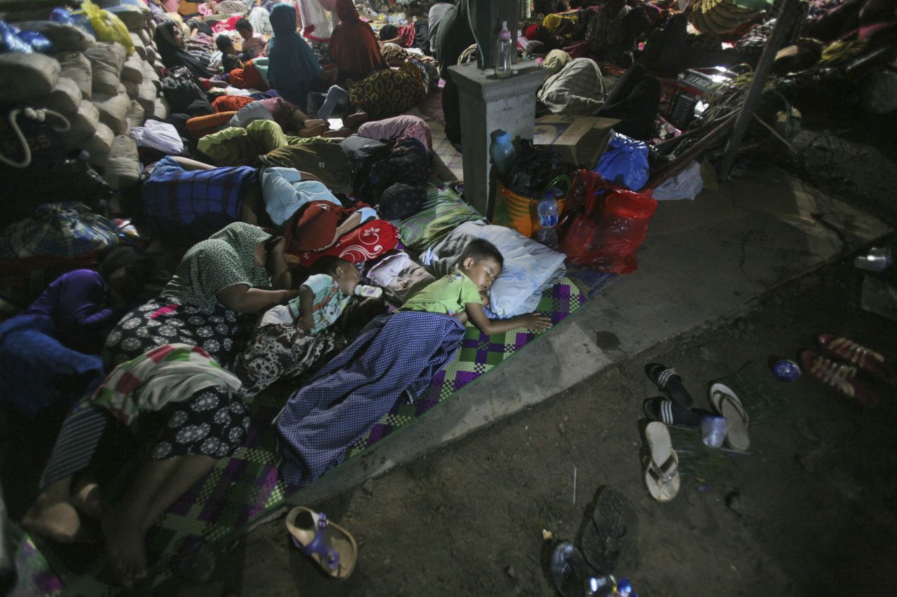 Quake survivors take refuge at a temporary shelter in Ulim, Aceh province, on December 8.
