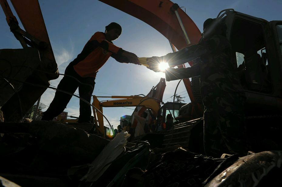 Members of Indonesia's search and rescue team continue to dig through rubble looking for earthquake survivors in Pidie Jaya, Aceh province, on Thursday, December 8. More than 100 people are confirmed dead after a 6.5-magnitude quake struck Wednesday, leveling buildings in the region.