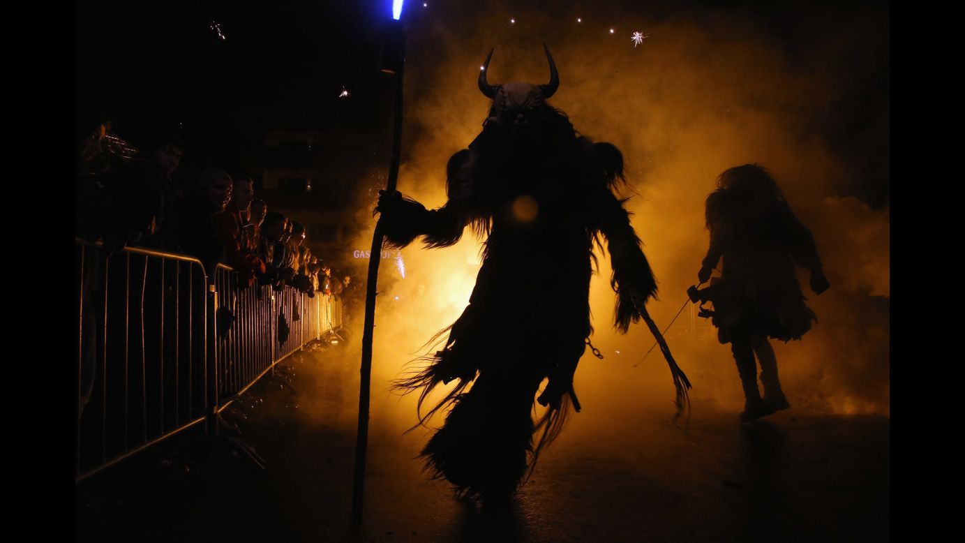 Revelers dressed as the Krampus creature parade through the street during the annual "Krampus Run" in Fieberbrunn, Austria, on Saturday, December 3. Krampus is a half-goat, half-demon figure from Alpine folklore and during the Christmas season, many people in Austria and other parts of Central Europe dress up as the horned figure. Krampus seeks to punish children who have misbehaved -- a contrast to Saint Nicholas, who rewards children for good behavior. 