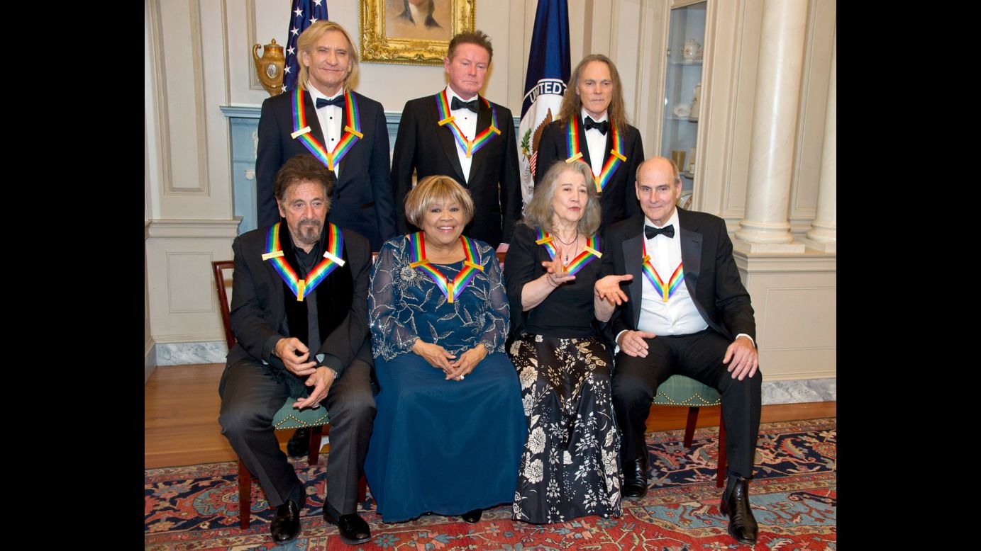The recipients of the <a href="http://www.cnn.com/2016/12/05/entertainment/kennedy-center-honors-al-pacino-james-taylor/" target="_blank">39th Annual Kennedy Center Honors</a> pose for a group photo after a dinner hosted by US Secretary of State John Kerry in Washington on Saturday, December 3. In the back row are the three surviving members of the Eagles: Joe Walsh, left, Don Henley and Timothy B. Schmidt. Seated are actor Al Pacino, left, gospel singer Mavis Staples, pianist Martha Argerich and singer-songwriter James Taylor.