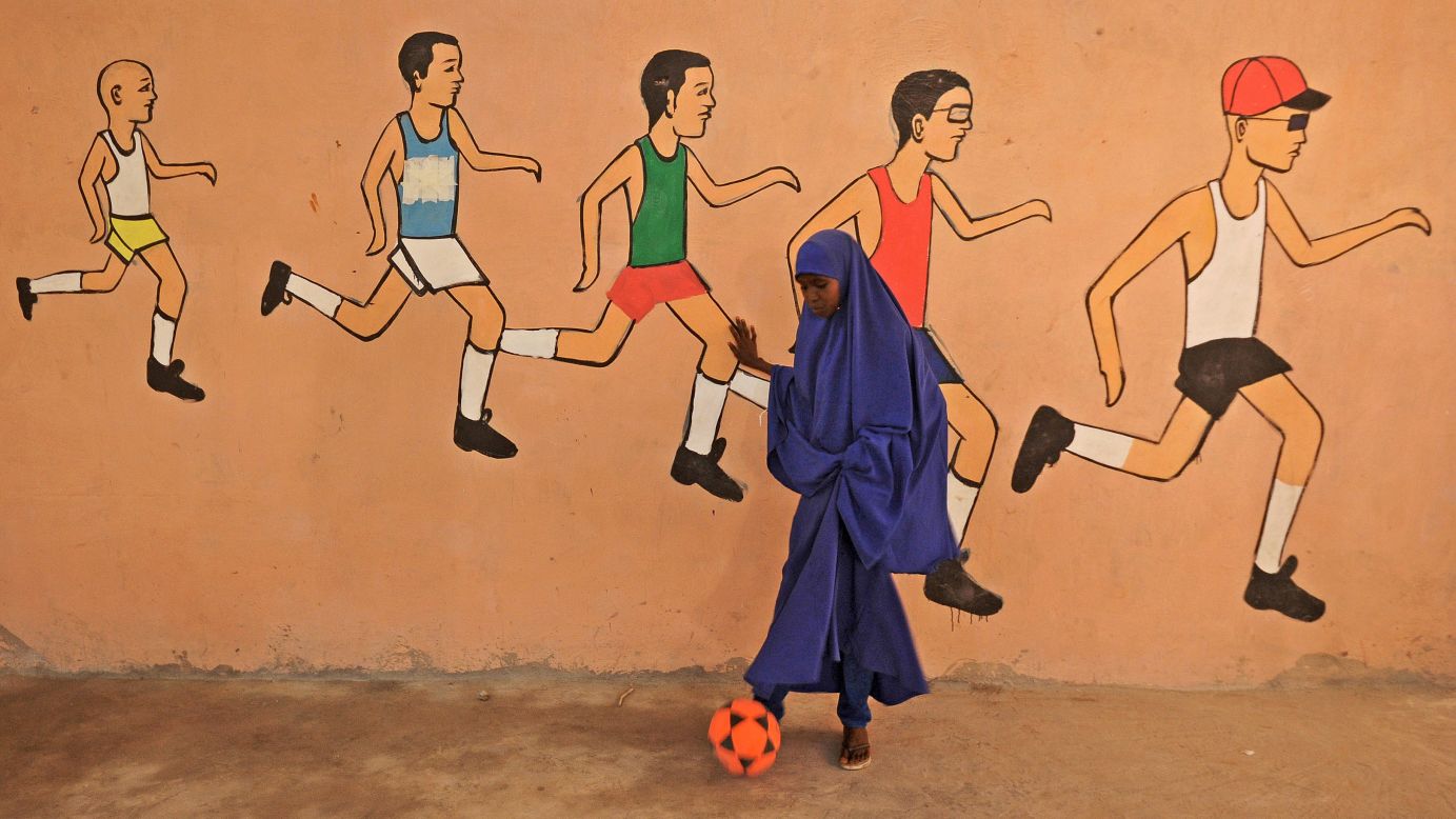 A girl kicks a ball during a sports lesson at a school in Mogadishu, Somalia, on Tuesday, December 6.