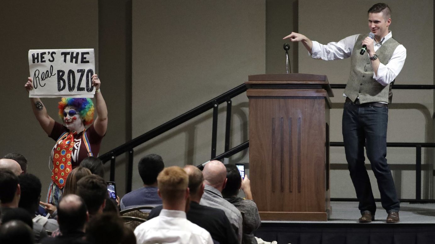 Richard Spencer, a white nationalist who helped found the so-called alt-right movement, points to a demonstrator carrying a sign as he speaks at Texas A&M University in College Station, Texas, on Tuesday, December 6. Spencer, whose appearance <a href="http://www.cnn.com/2016/12/06/politics/richard-spencer-texas-am/index.html" target="_blank">drew wide protests</a>, was invited to speak by Texas A&M alum Preston Wiginton, not by the university.
