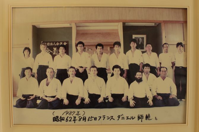Several photographs hang inside Aikido Tanabe Dojo highlighting visits by foreign aikidokas.  