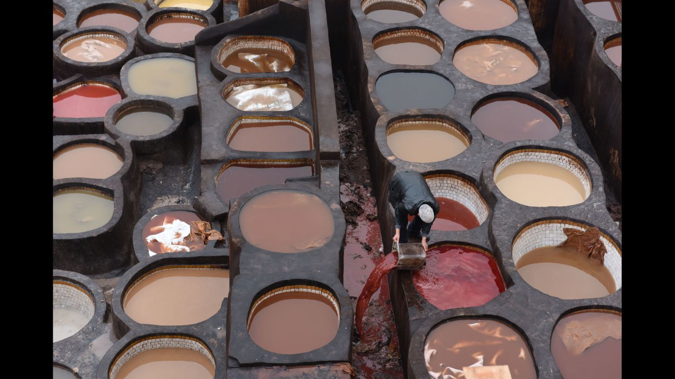 Dried-earth pits are filled with various dyes and liquids at the Chouara Tannery in Fez, Morocco, on Tuesday, December 6. The Chouara Tannery is in the ancient Medina of Fez, a UNESCO Heritage Sight.