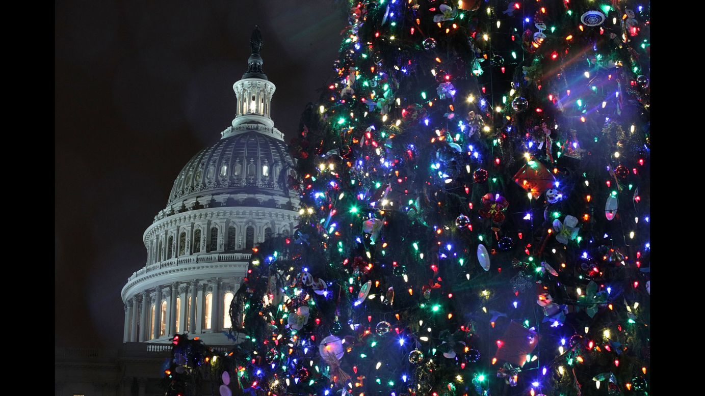 The US Capitol Christmas Tree stands at the West Front Lawn during a lighting ceremony in Washington on Tuesday, December 6. This year's tree is an 80-foot Engelmann Spruce from the Payette National Forest in Idaho.