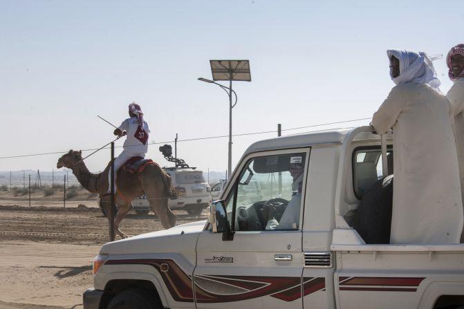 Spectators and trainers drove alongside the race in 4x4s and off-road vehicles to cheer the competitors. 