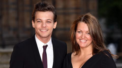 Louis Tomlinson and mother Johannah Deakin attend the Believe In Magic Cinderella Ball in London in August 2015. 