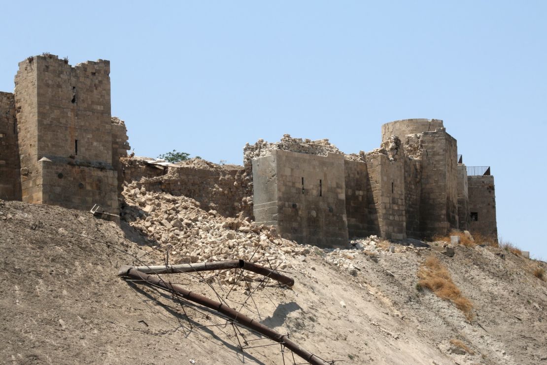 A July 2015 blast leaves the wall of the once monumental Citadel in Aleppo's old city damaged. 
