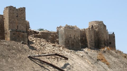 A July 2015 blast leaves the wall of the once monumental Citadel in Aleppo's old city damaged. 
