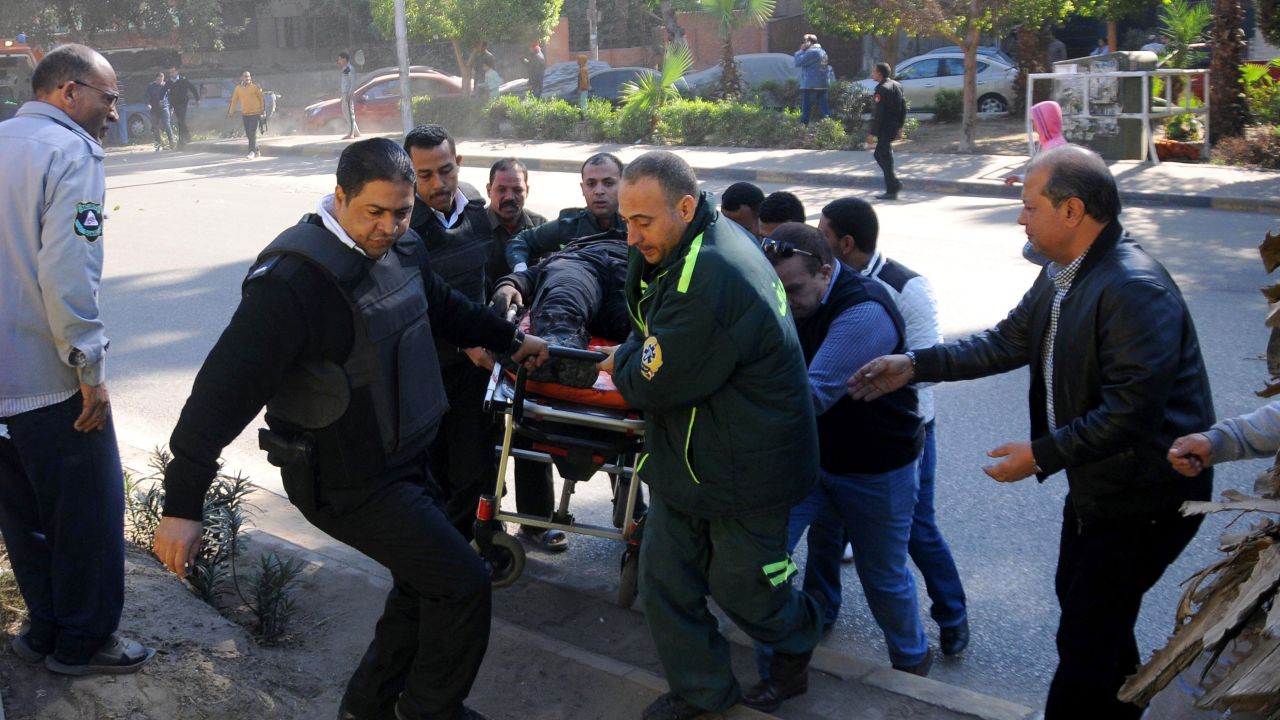 Emergency services transport a bomb attack victim west of Cairo.