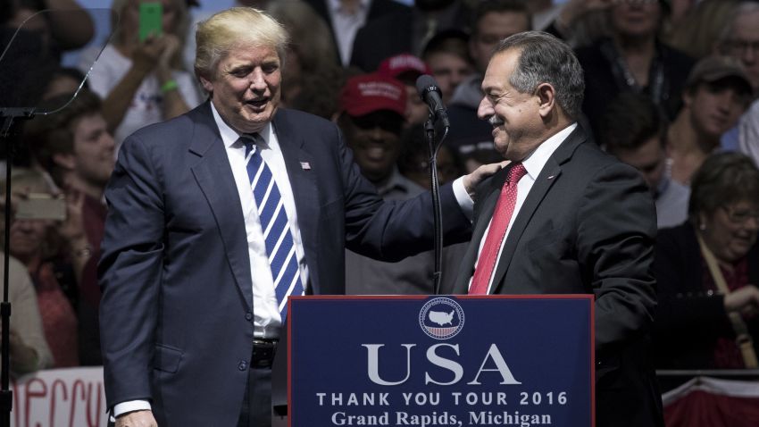 President-elect Donald Trump introduces Andrew N. Liveris, chief executive officer of The Dow Chemical Company and Trump's choice to be the head of a national manufacturing council, at the DeltaPlex Arena, December 9, 2016 in Grand Rapids, Michigan.