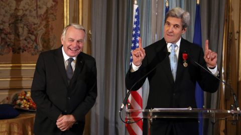 Secretary of State John Kerry and France's Jean-Marc Ayrault share a light moment Saturday in Paris.