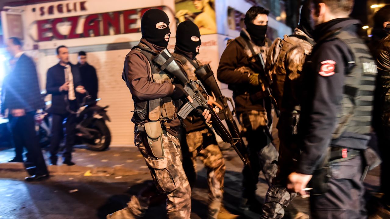Turkish special police officers patrol streets after a car bomb exploded near the stadium.
