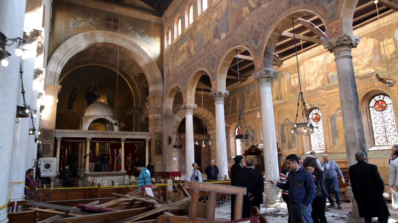  Security officials and people inspect the damage inside St. Peter and St. Paul Coptic Orthodox Church after a bombing in Cairo, Egypt, 11 December 2016. 