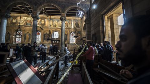 Egyptian security forces inspect the scene of the explosion at the Coptic Orthodox Church.