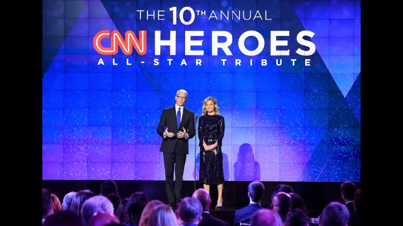 Hosts Anderson Cooper and Kelly Ripa speak onstage during the CNN Heroes gala 2016 at the American Museum of Natural History on Sunday, December 11, in New York.